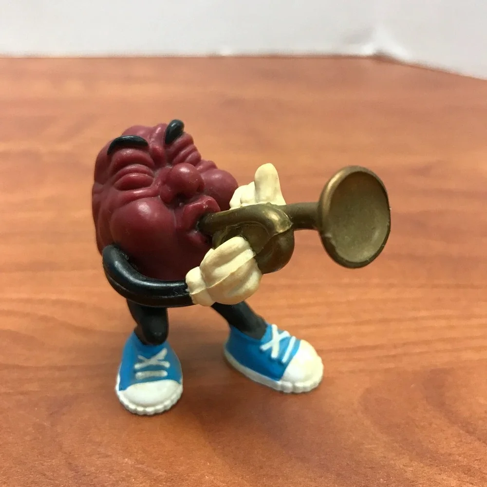 4 Vintage California Raisins figurines - Guitar - Skateboard - Surfer - Trumpet